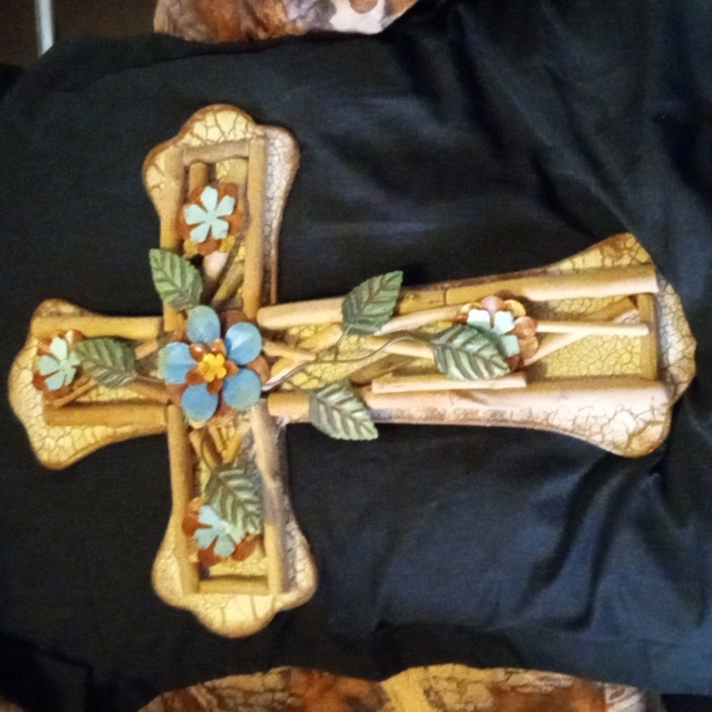 This is a very unique cross it is heavy it's painted with unique designs